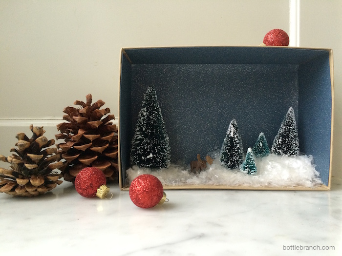 completed and styled winter vignette bottle branch blog